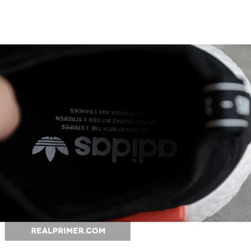 NMD_R1 BOOST SHOES CORE BLACK/CORE BLACK/CLOUD WHITE GZ7922