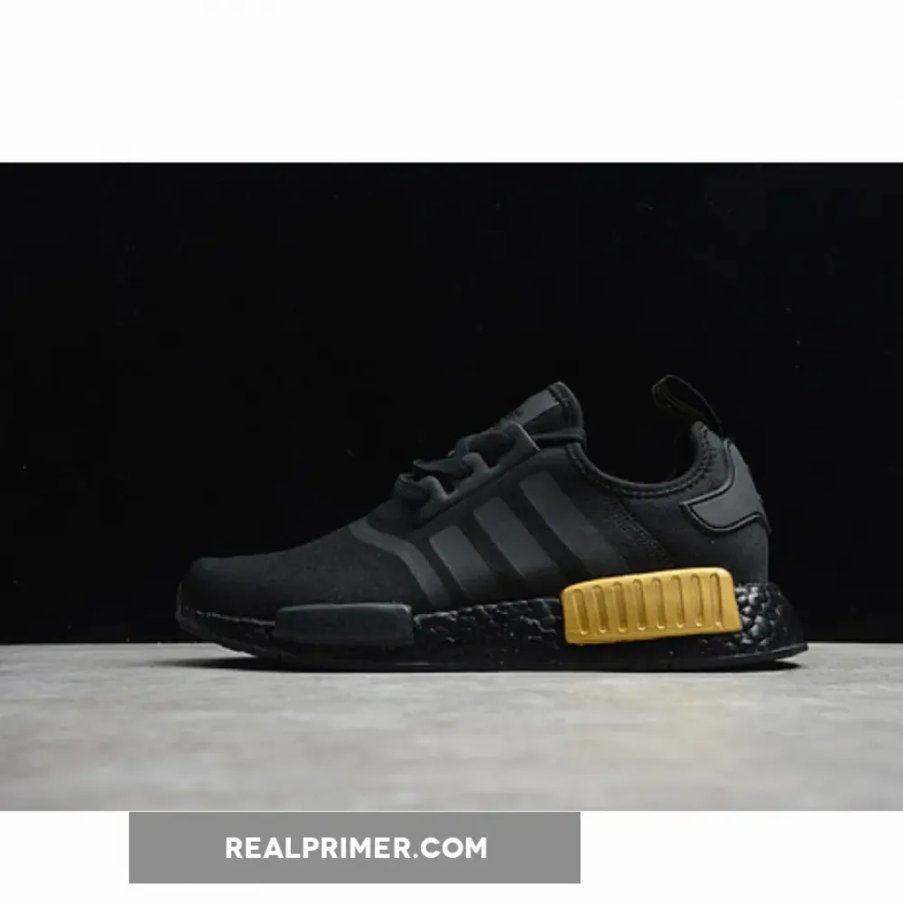 NMD_R1 SHOES CORE BLACK/CORE BLACK/GOLD METALLIC FV1787