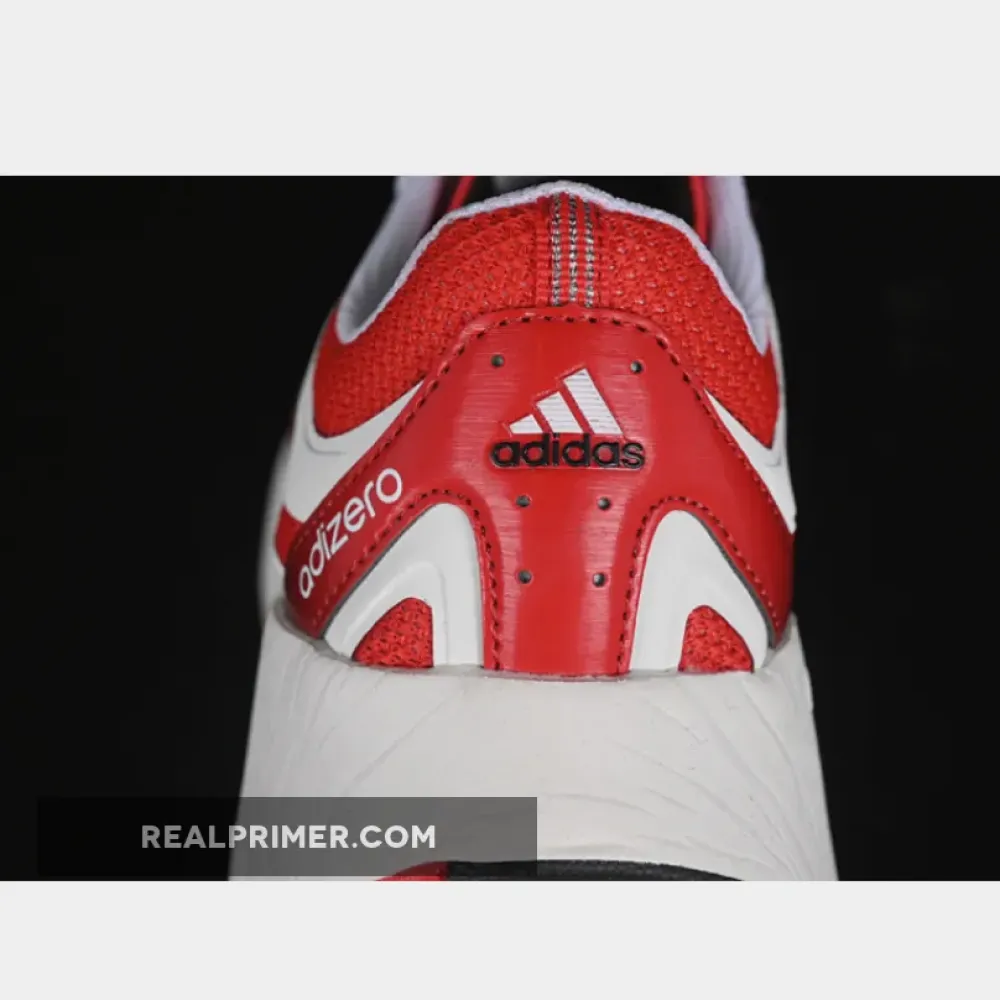 ADIZERO ARUKU CLOUD WHITE/PURE RUBY/CORE BLACK JI0308