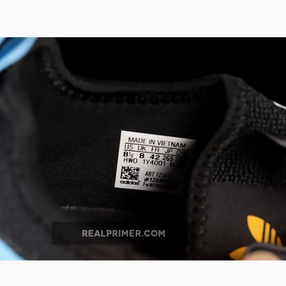 NMD_R1 SHOES CORE BLACK/CLOUD WHITE/COLLEGIATE GOLD FZ5876