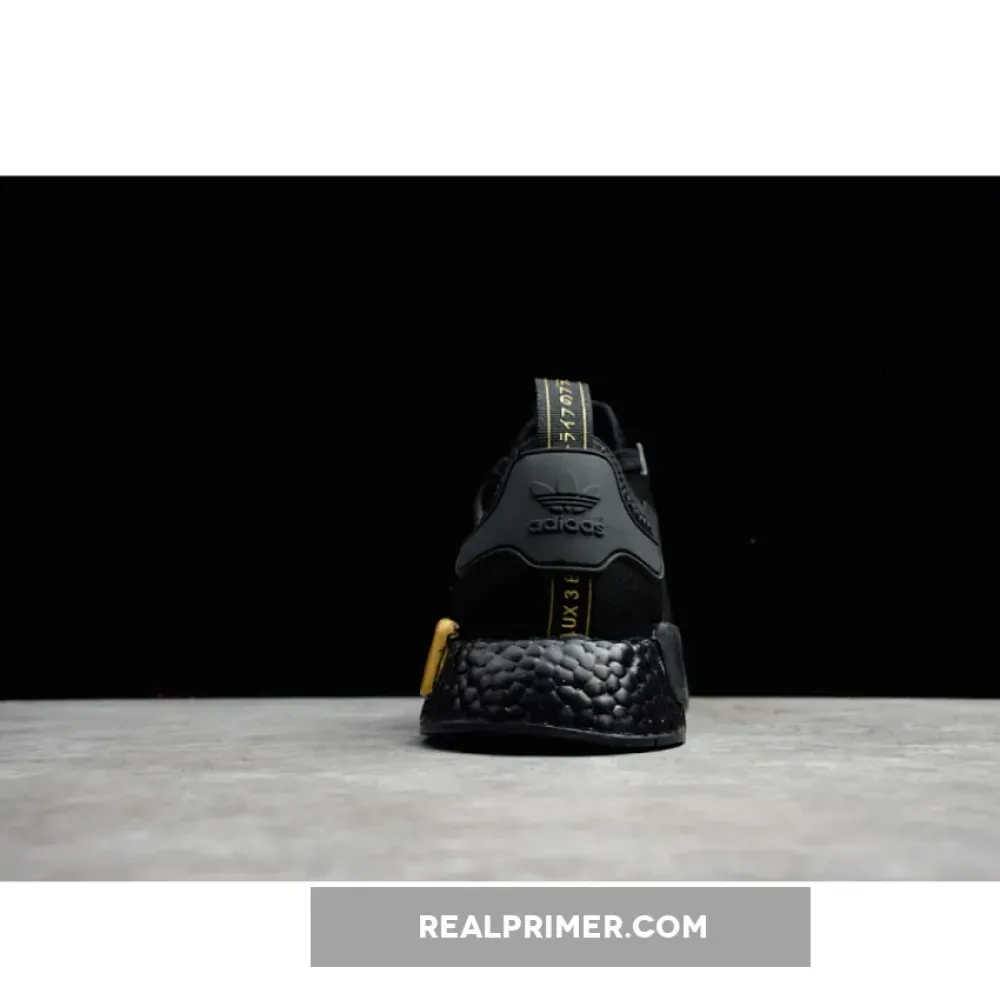NMD_R1 SHOES CORE BLACK/CORE BLACK/GOLD METALLIC FV1787
