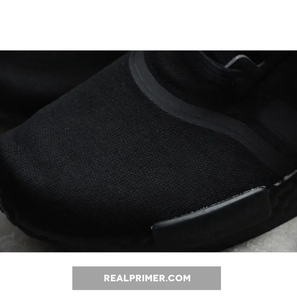 NMD_R1 SHOES CORE BLACK/CORE BLACK/GOLD METALLIC FV1787