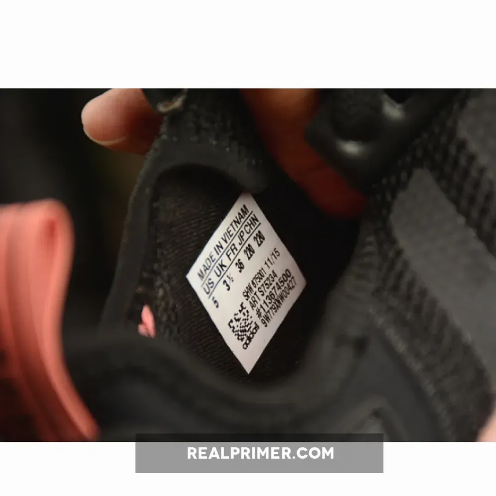 NMD R1 BOOST SYNTHETICS WMNS CORE BLACK/PEACH PINK S75234